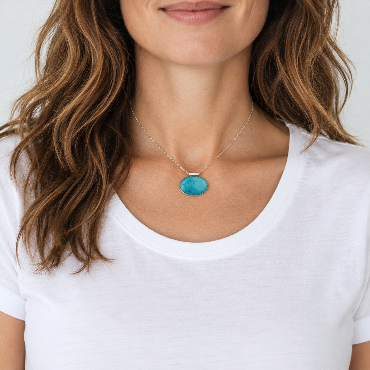 Reclaimed turquoise-blue stone pendant worn on approximately 40 cm recycled sterling silver chain